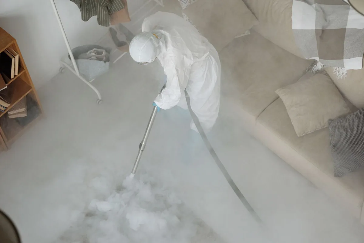 Biohazard cleanup technician in protective equipment, Parma Heights, OH